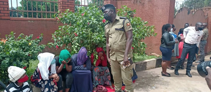 Police with some of the arrested girls